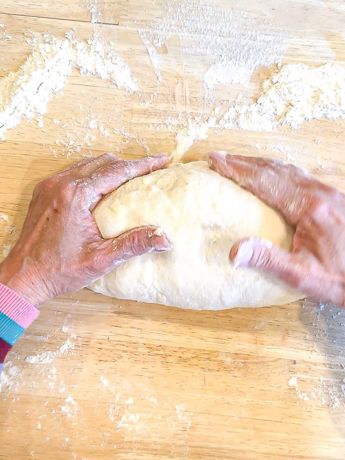 Rolling dough into a log.