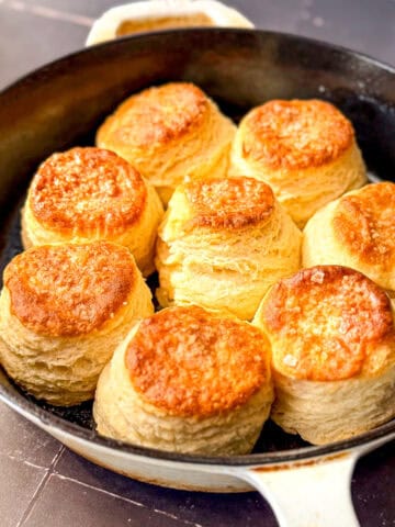 Buttermilk biscuits in a cast-iron pan.