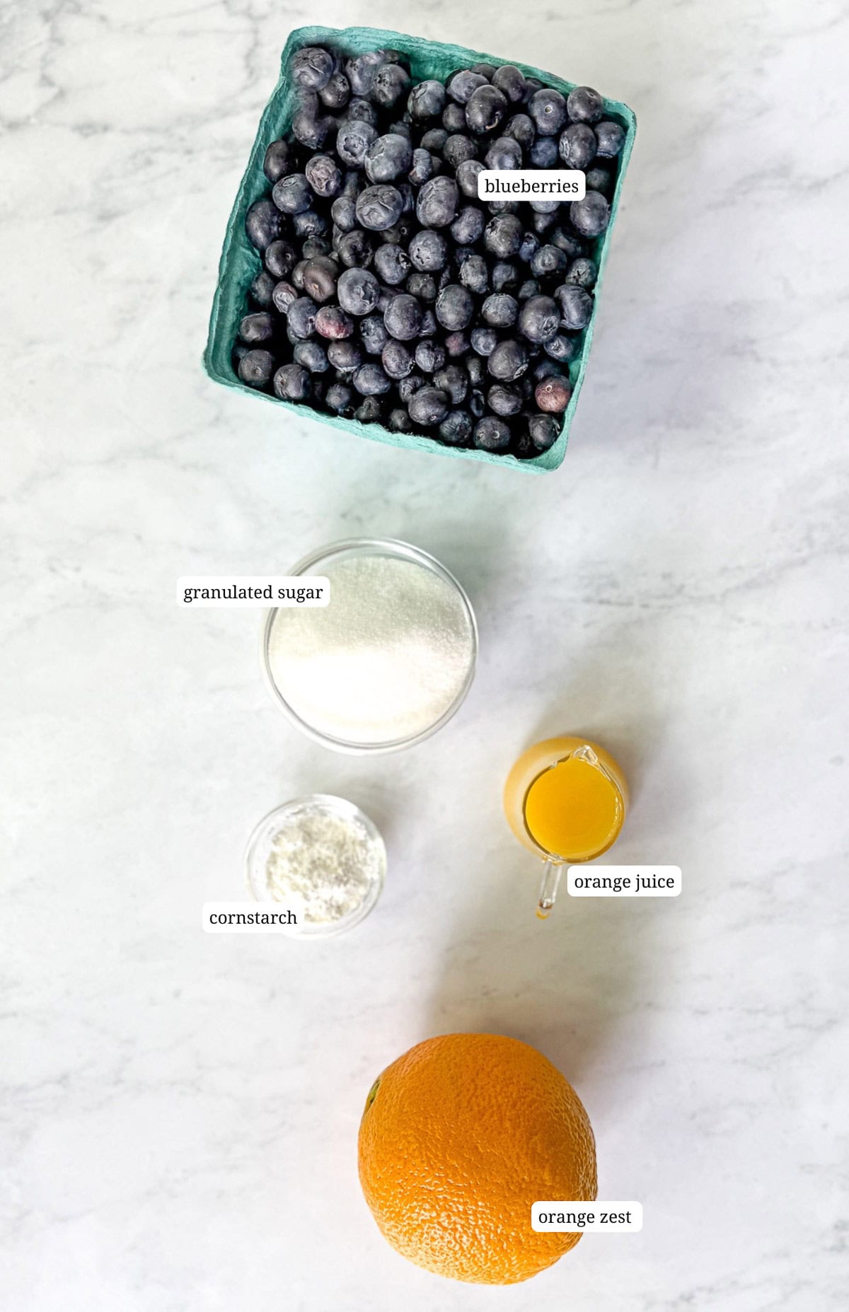 Ingredients to make easy homemade blueberry jam.