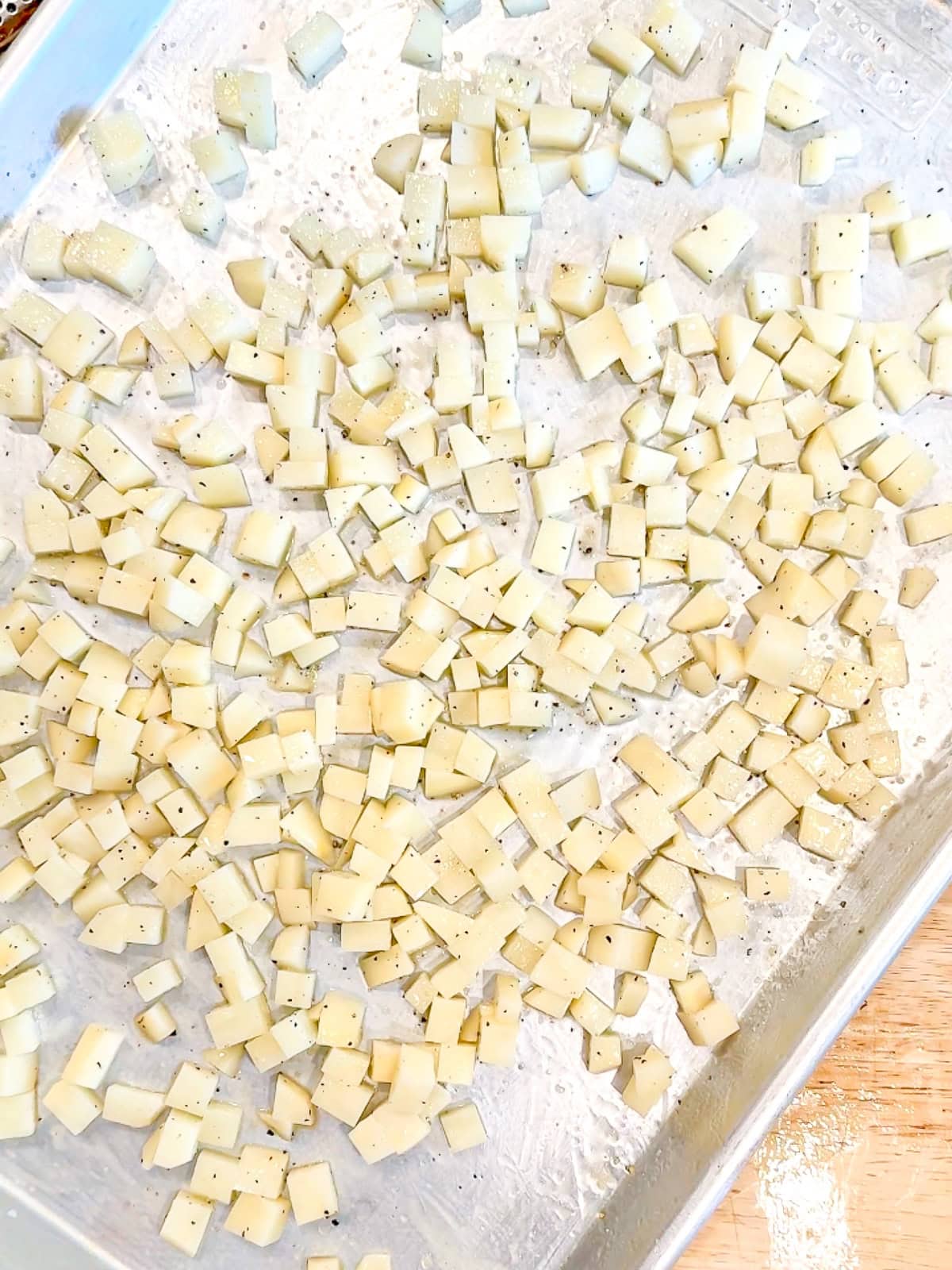 Diced potatoes on a sheet pan.