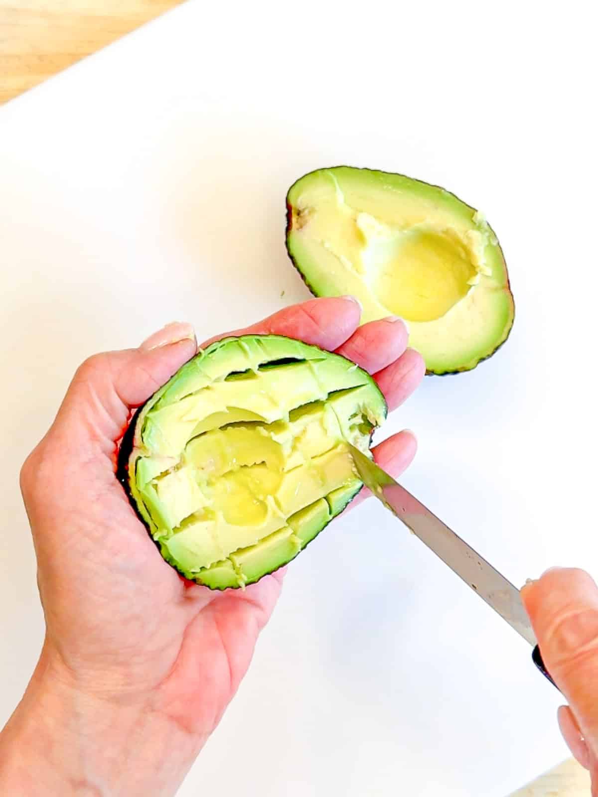 Dicing and avocado in the skin.