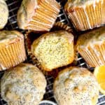 Lemon poppy seed muffins on a wire rack.
