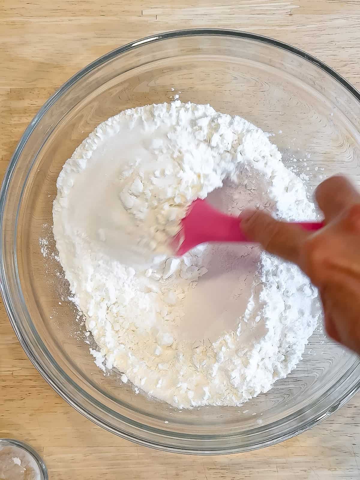 Mixing dry ingredients to make mochi waffles.