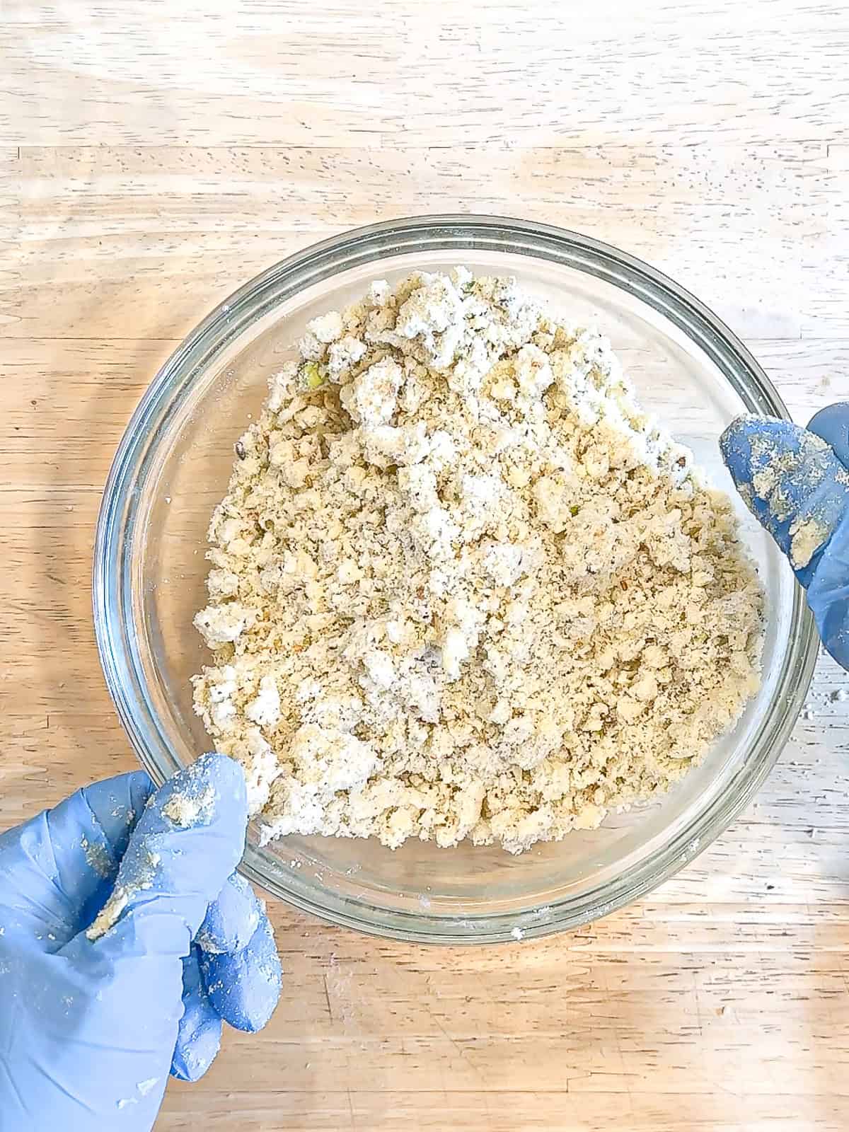 Pistachio streusel in a glass bowl.