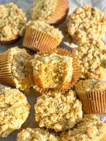 Pistachio muffins on parchment paper.