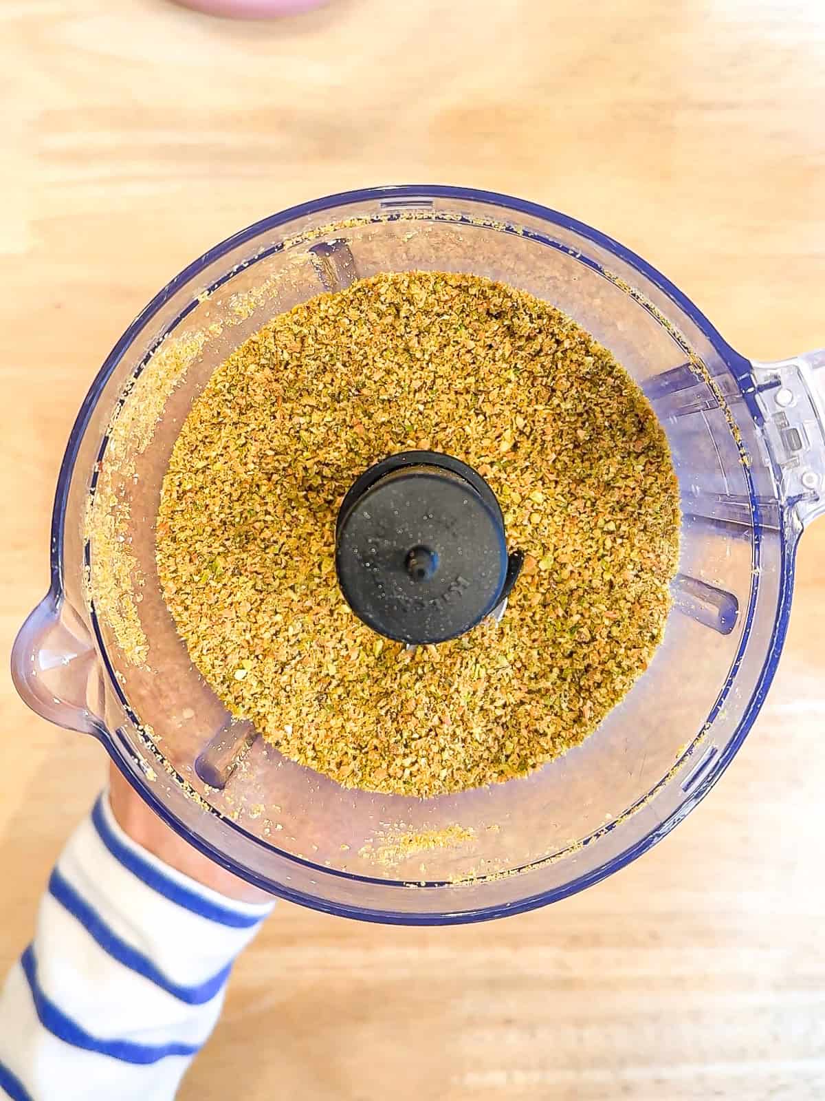 Ground pistachios in a food processor.