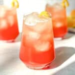 Three aperol spritz in glasses.