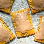 Brown sugar cinnamon pop tarts on parchment paper.