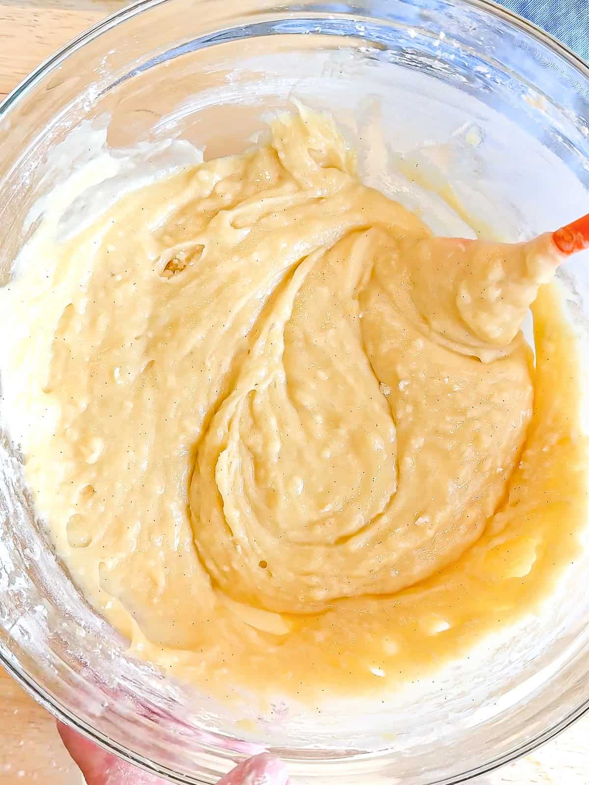 Cake batter in a glass bowl.