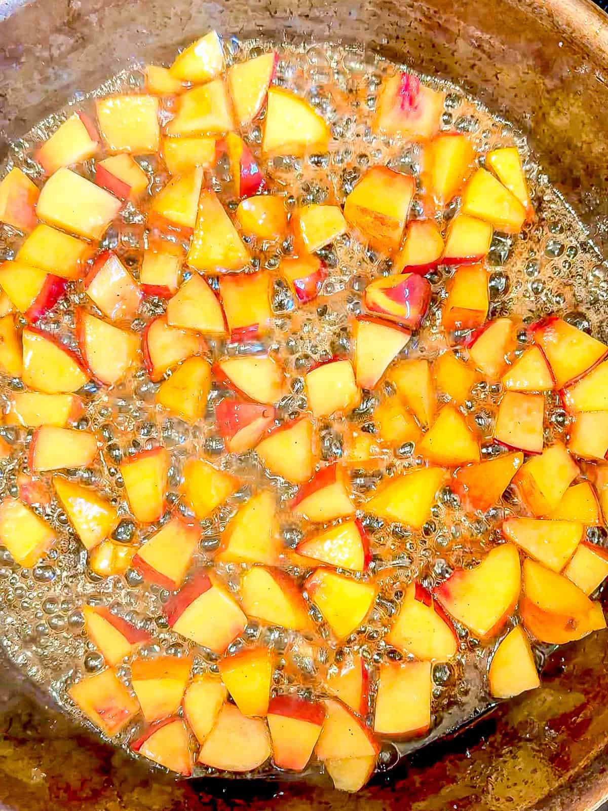 Cooking brown sugar peaches.