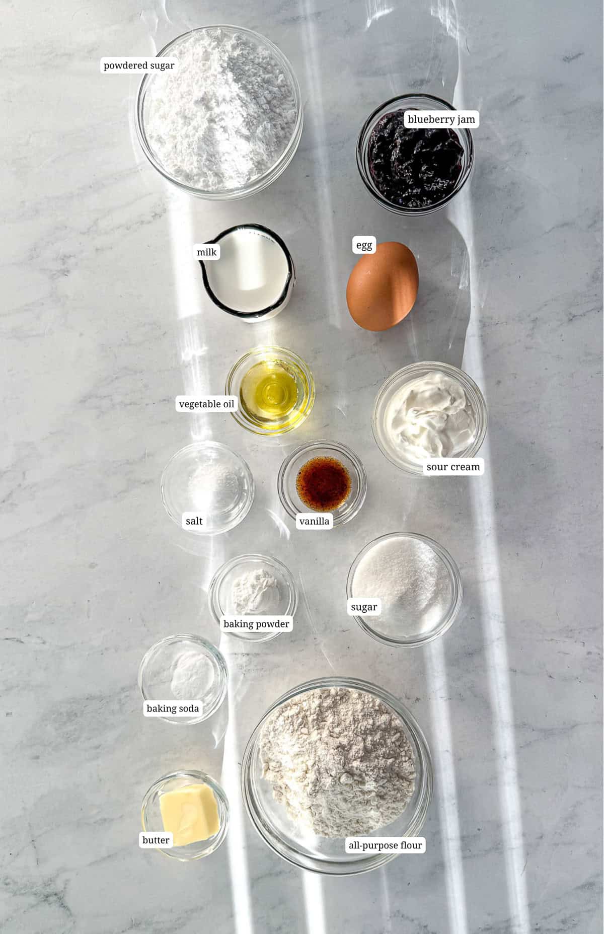 Ingredients needed to make blueberry swirl donuts.