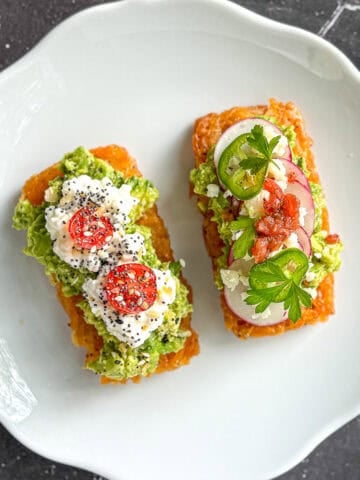 Various hash brown avocado toast on a white plate.