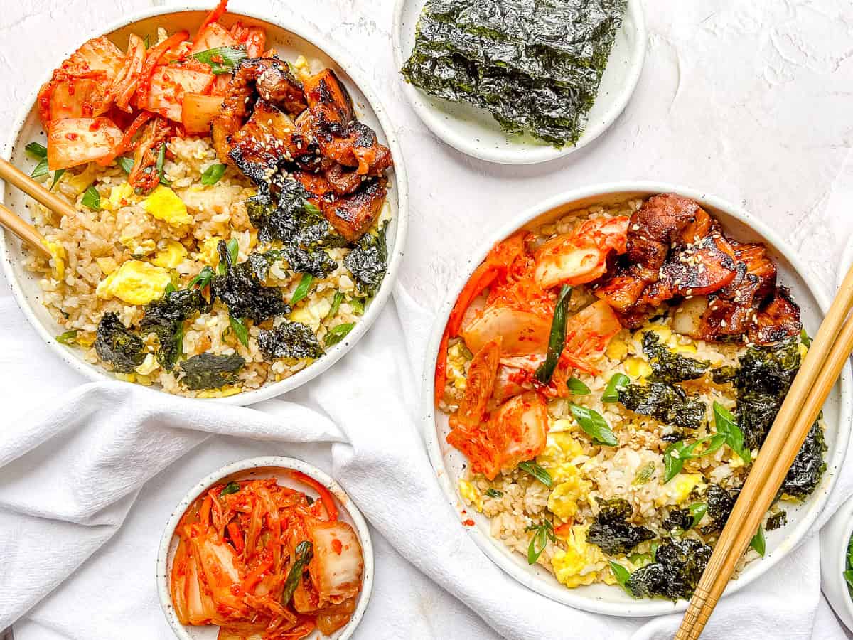 Egg fried rice served with a side of kimchi.