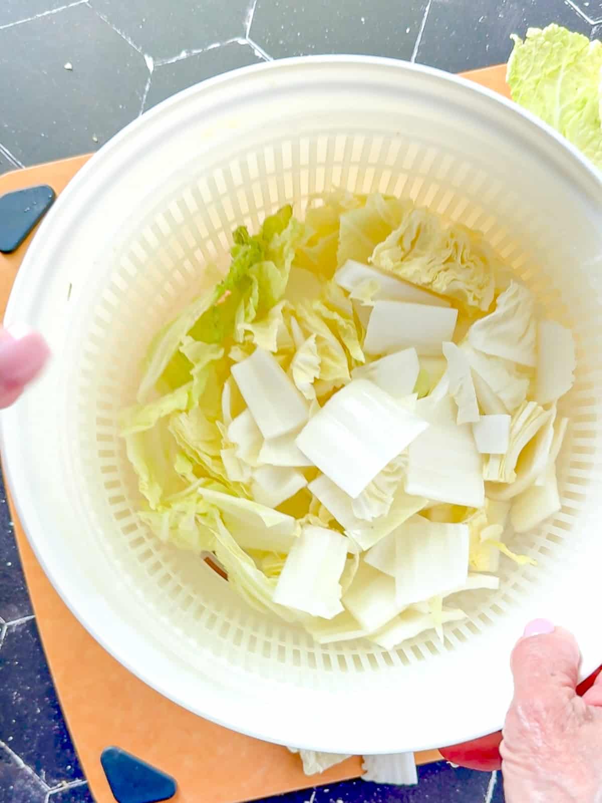 Rinsing and draining brined cabbage.