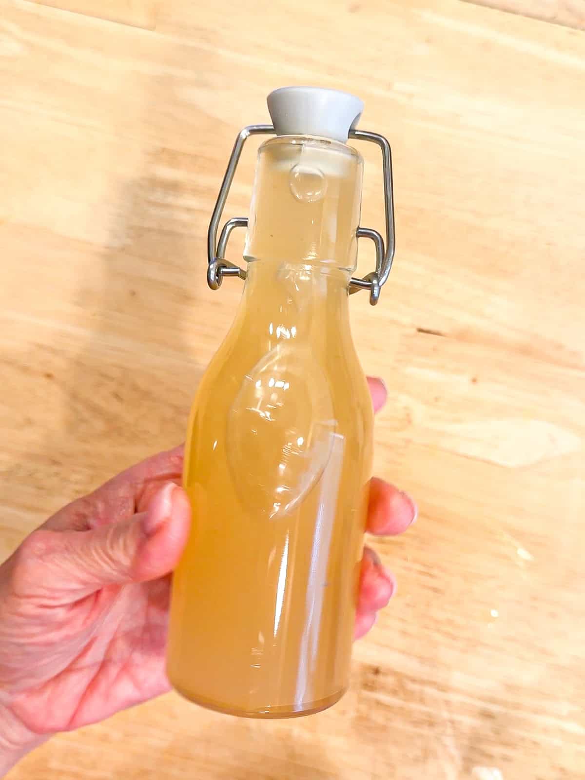 Glazed doughnut simple syrup in a glass bottle.
