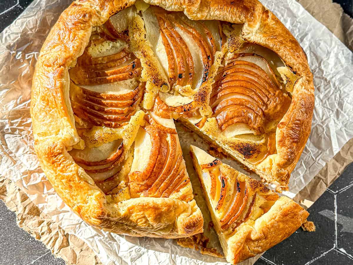 Pear galette on parchment paper.