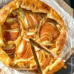 Pear galette on parchment paper.