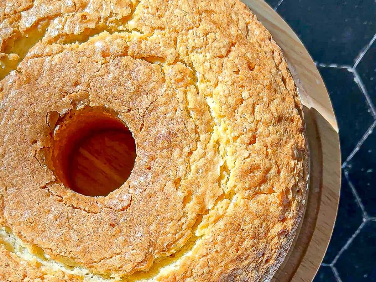 Closeup of a pound cake with a cracked and crackly top crust.