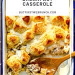 Pinterest image of a wooden spoon scooping a biscuits and gravy casserole.