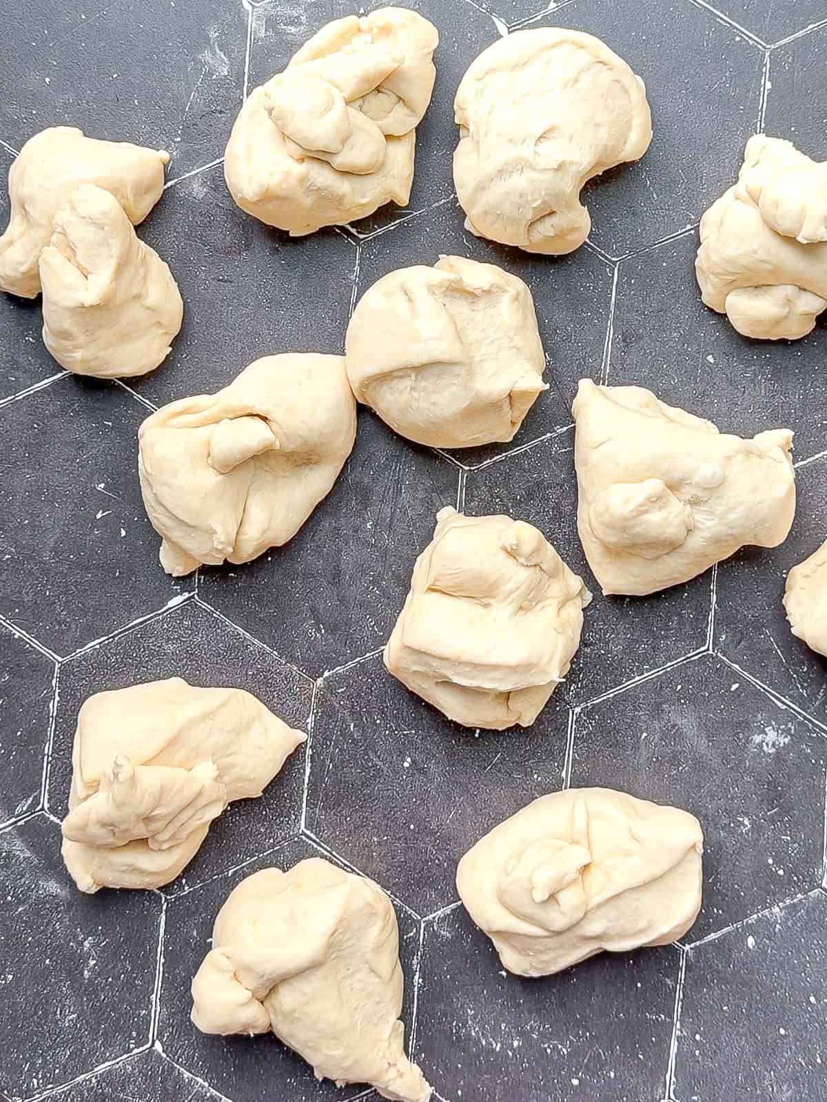 Blops of dough on a black background.