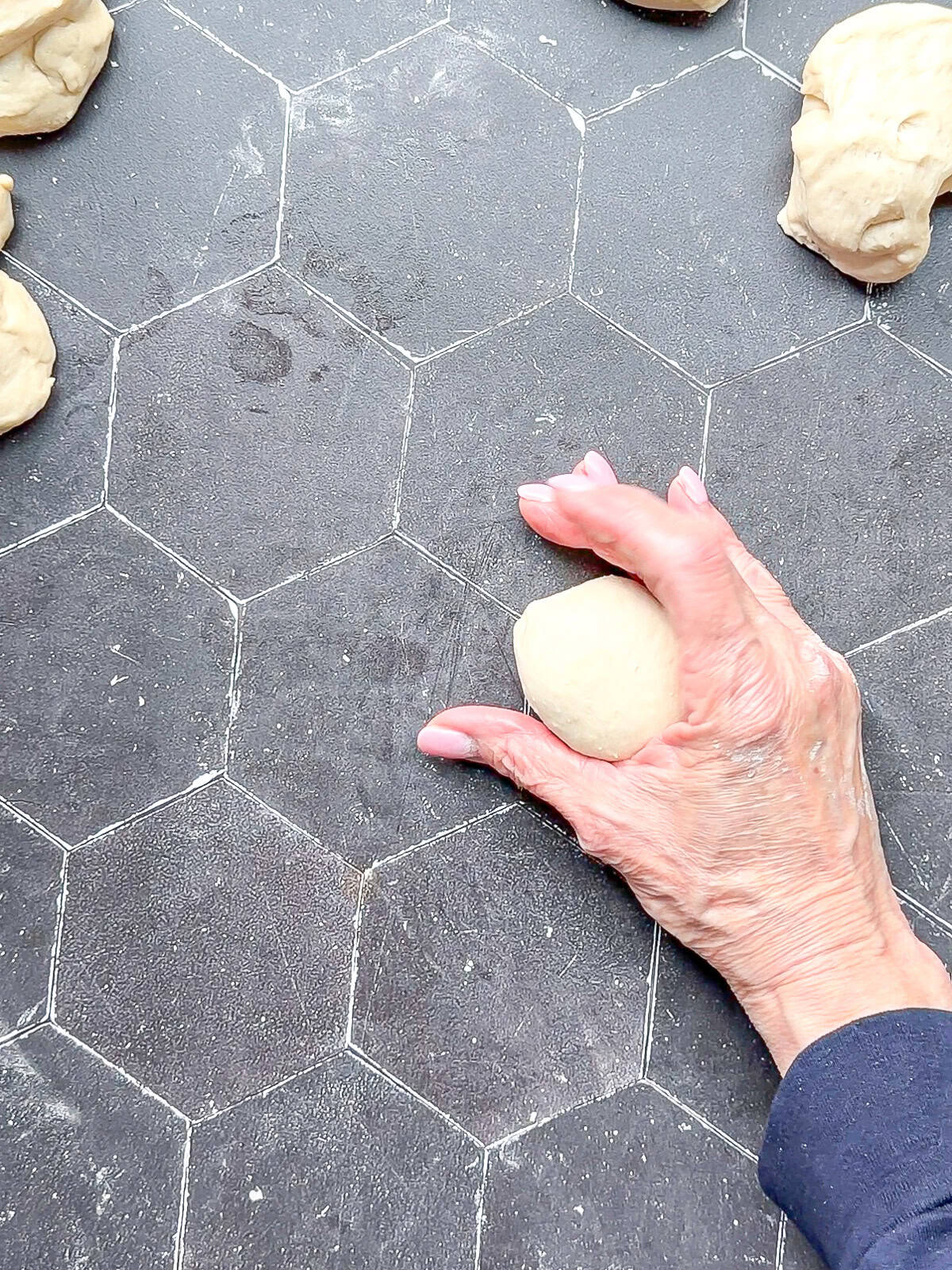 Rolling a ball of dough in my cup hand.