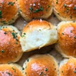 Dinner rolls with chive butter and flaky salt.