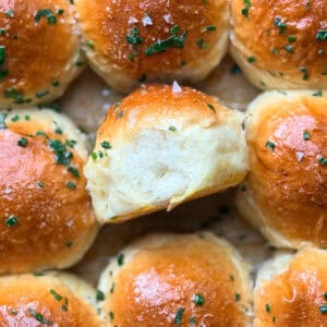 Dinner rolls with chive butter and flaky salt.
