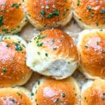 Dinner rolls with chive butter and flaky salt.