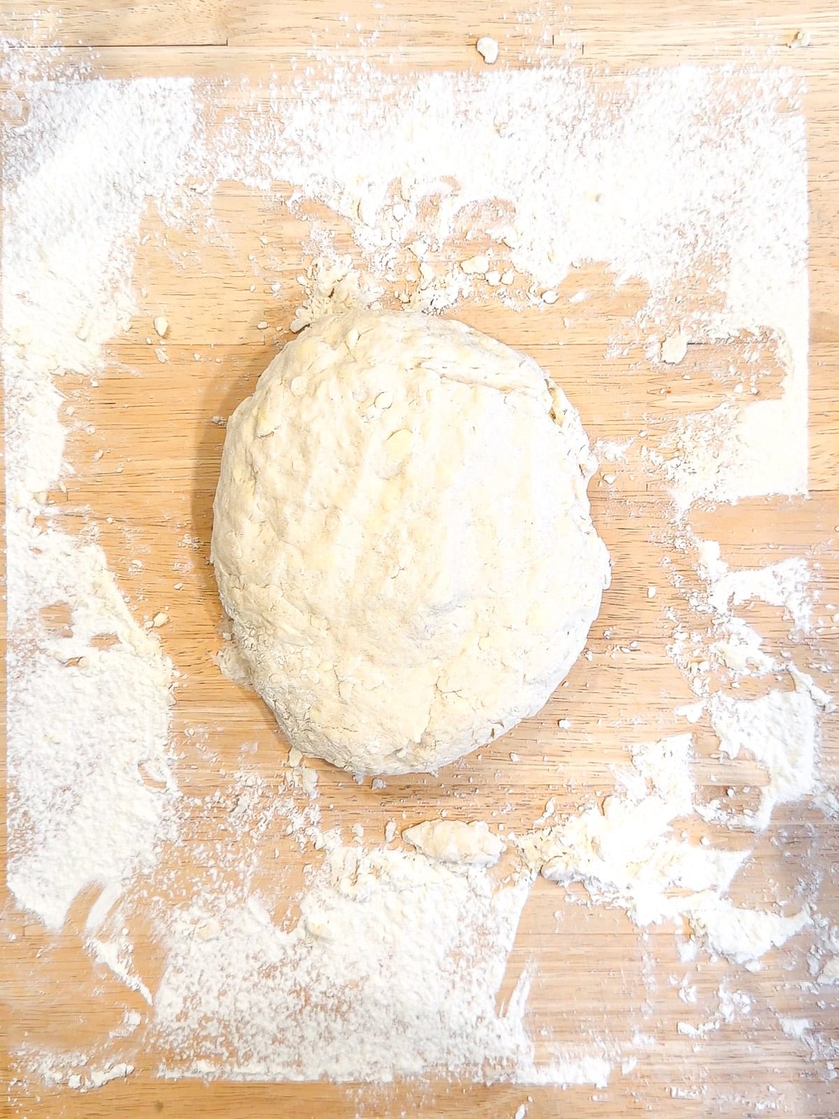 Biscuit dough on a floured counter.