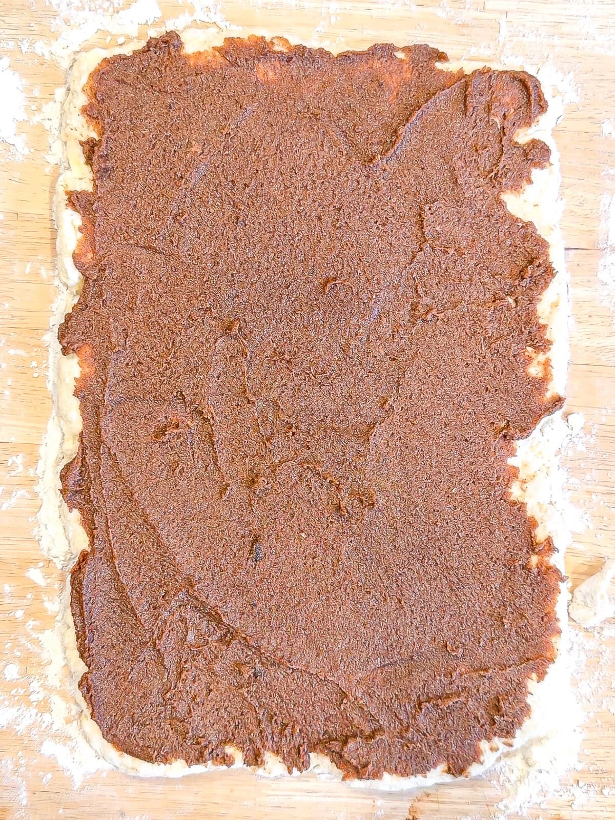 Biscuit dough covered in cinnamon sugar butter.