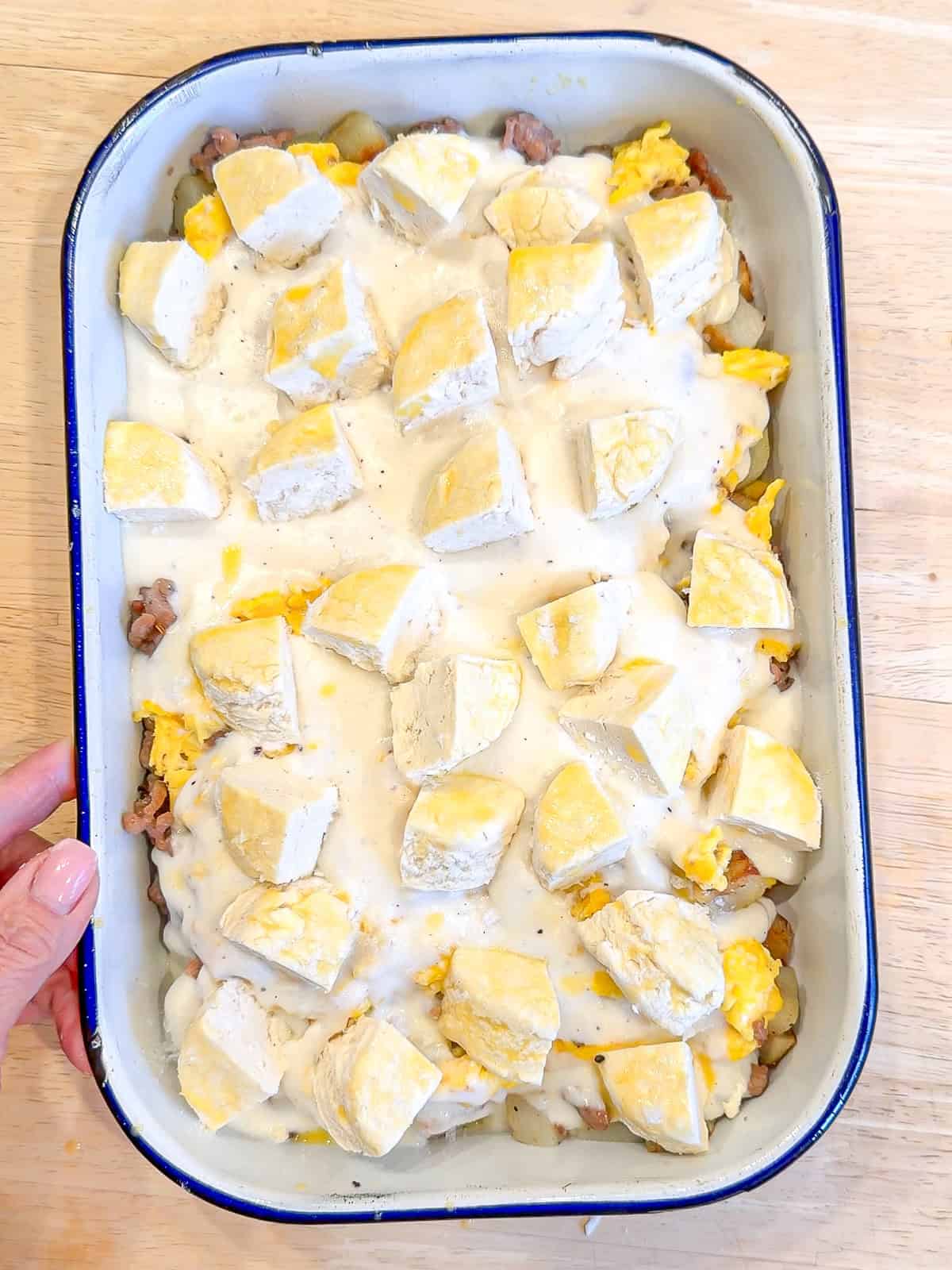 Biscuits and gravy casserole before going into the oven.