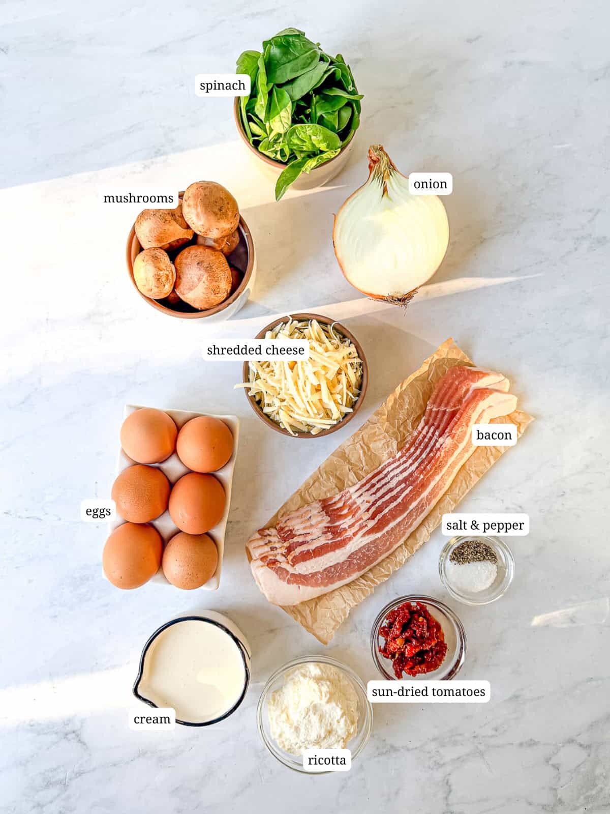 Labeled image of ingredients needed to make a sheet pan frittata.