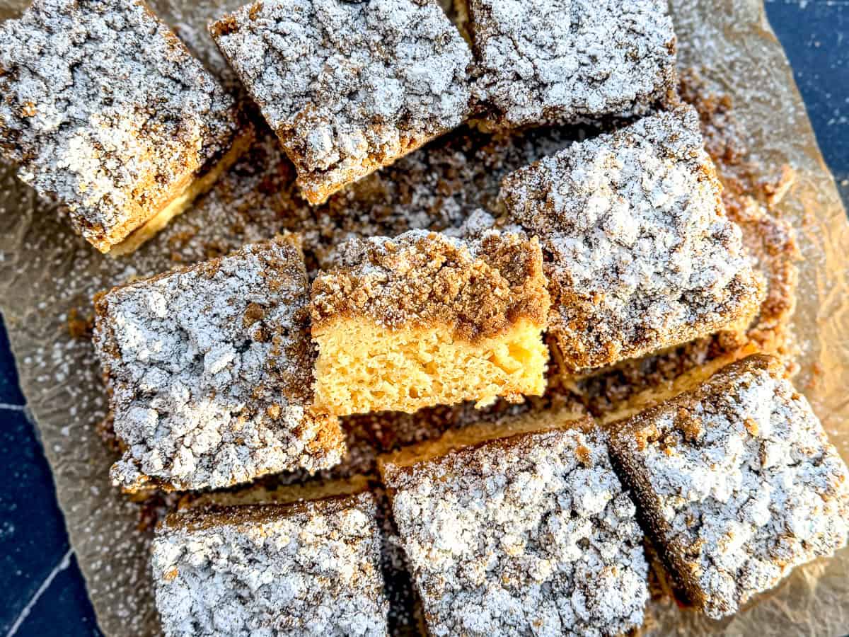Slices of crumb cake on parchment paper.
