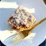 Crumb cake on a white plate.