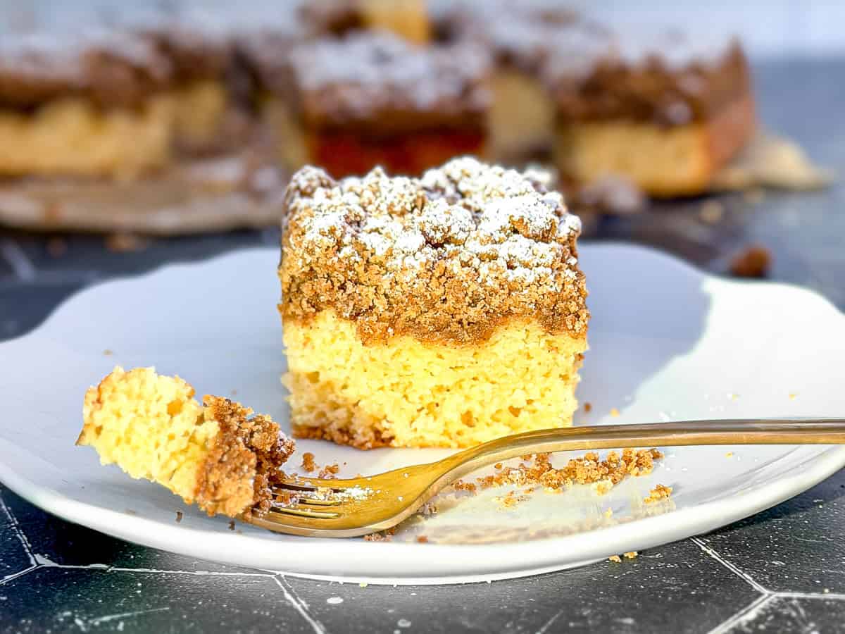 Crumb cake on a white plate.