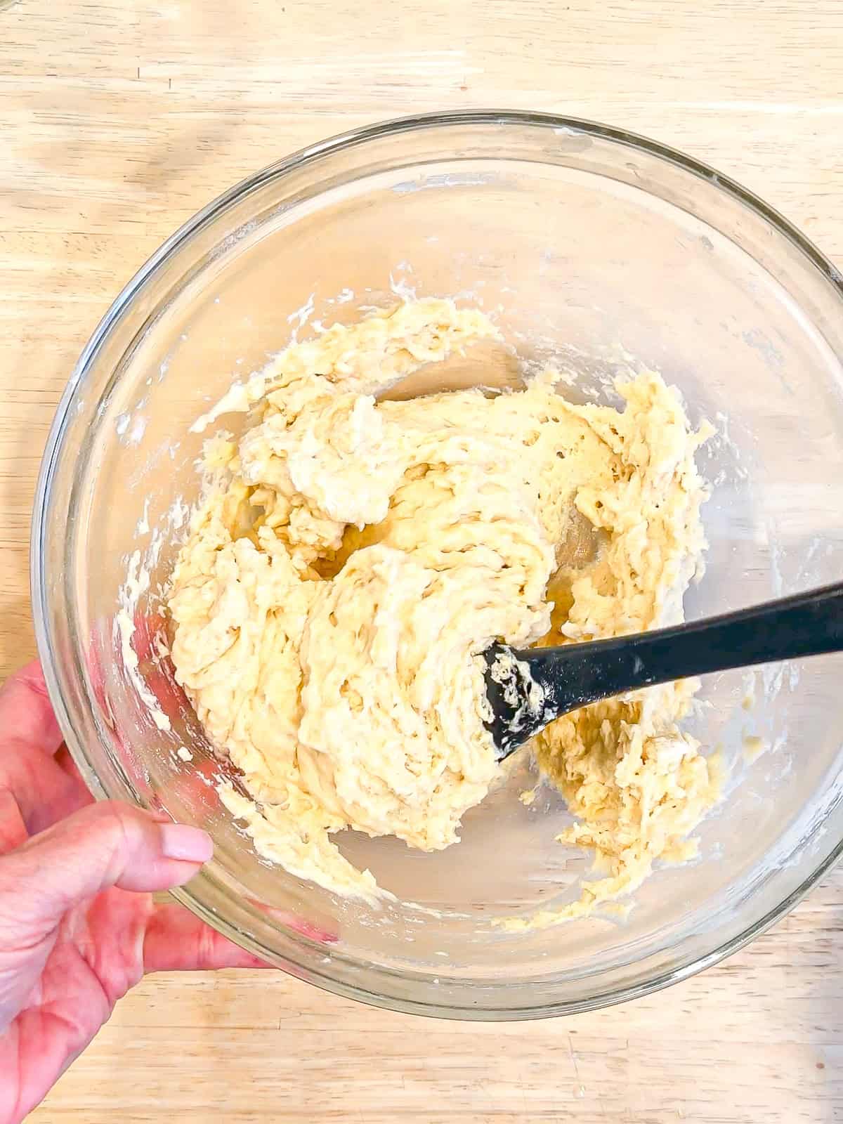 Cake batter in a glass bowl.
