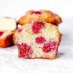 Cut view of a raspberry banana muffin.