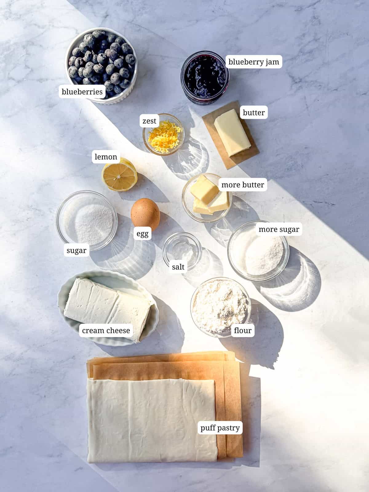 Ingredients needed to make blueberry cheesecake croissants.