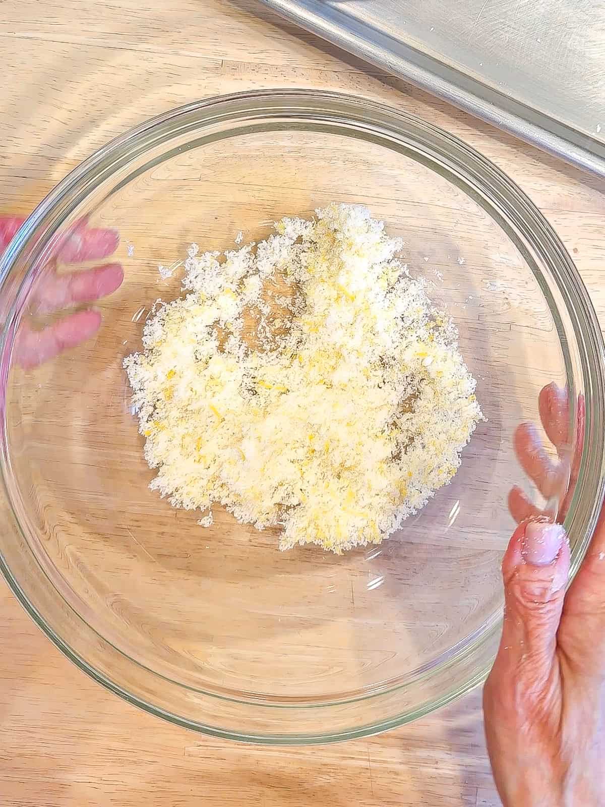 Lemon sugar in a glass bowl.