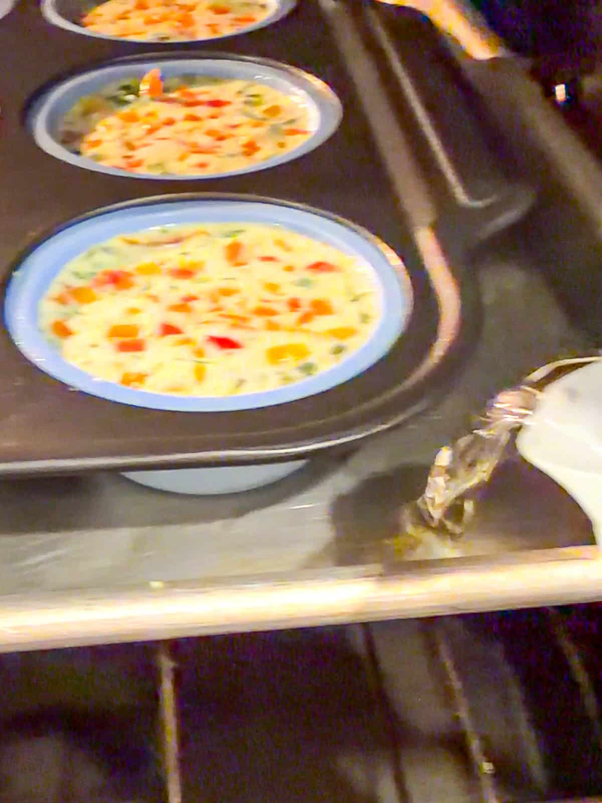 Pouring water into a pan to make a water bath.