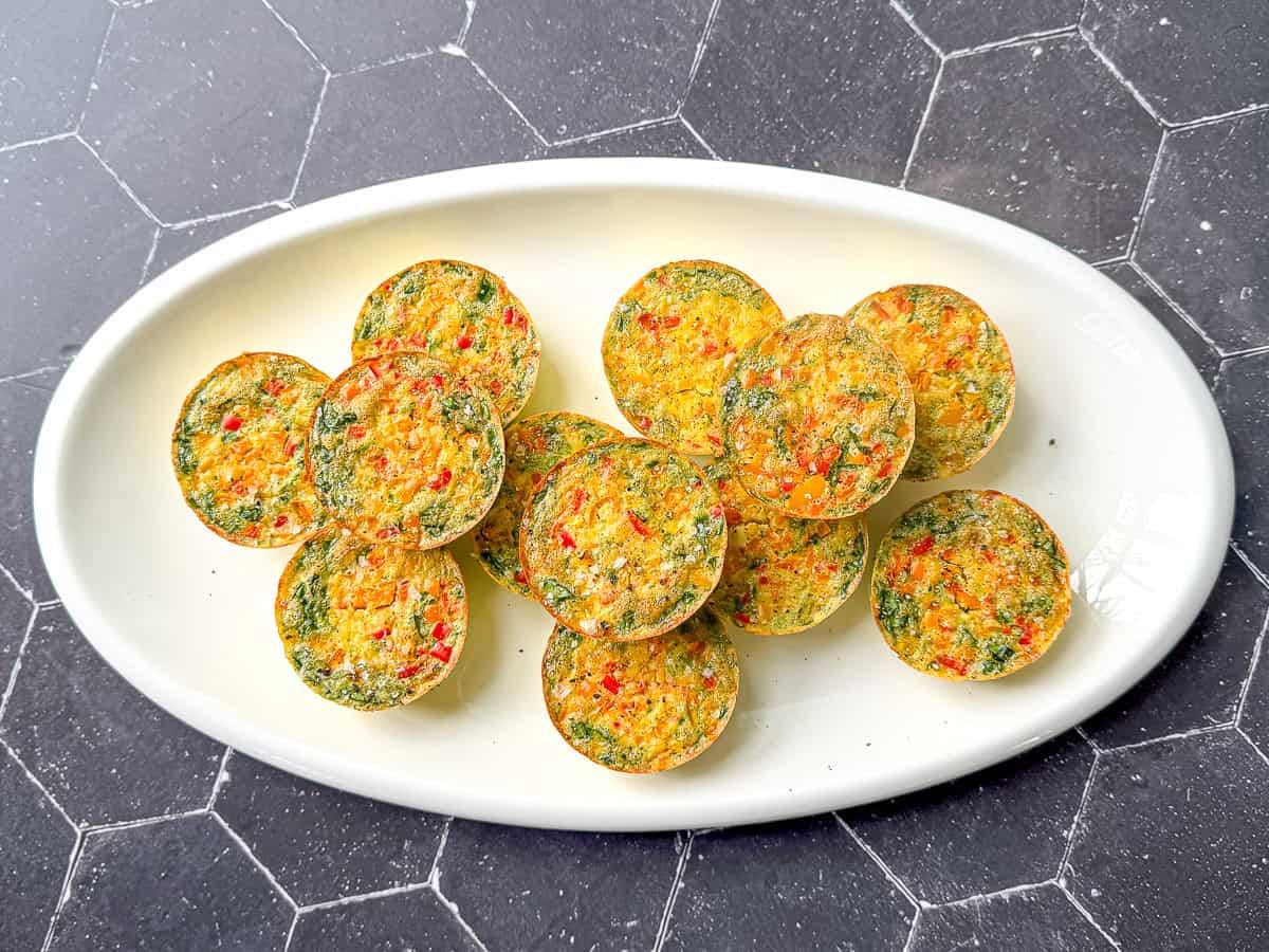 Sous vide egg bites on a white platter.
