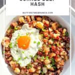 Pinterest image of a white bowl containing corned beef and a fried egg.