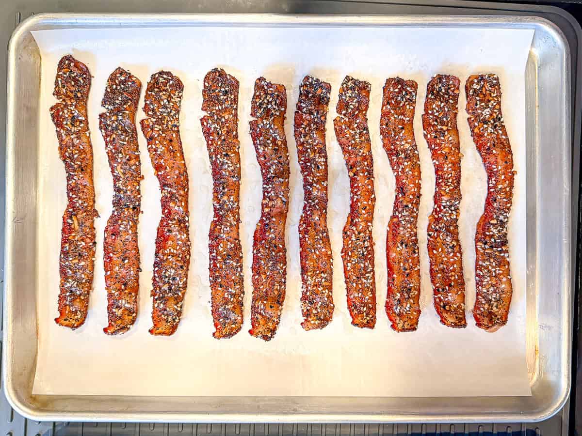 Everything seasoned vacant on a parchment paper lined baking sheet.