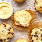 Irish soda bread muffins and a crock of salted butter on parchment paper.