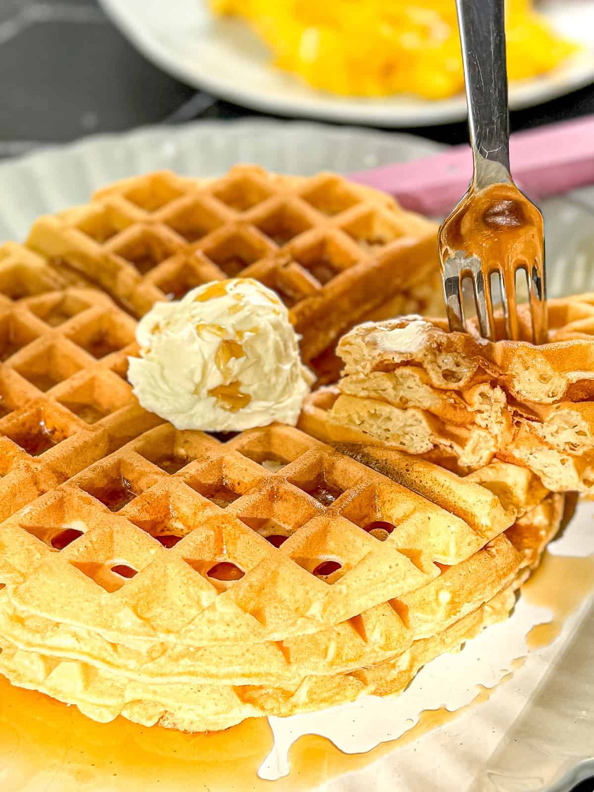 Waffle House style pancakes with a scoop of whipped salted butter on top.
