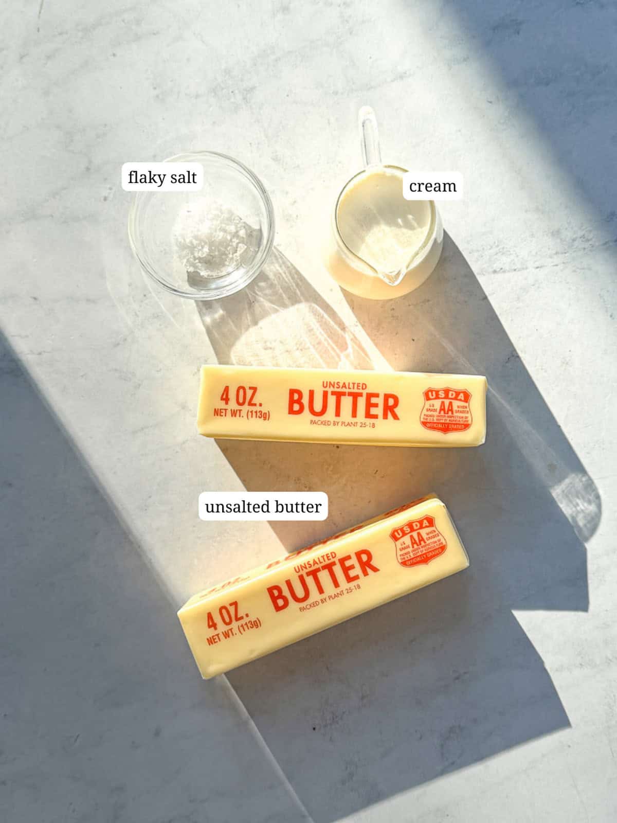Ingredients needed to make whipped salted butter.