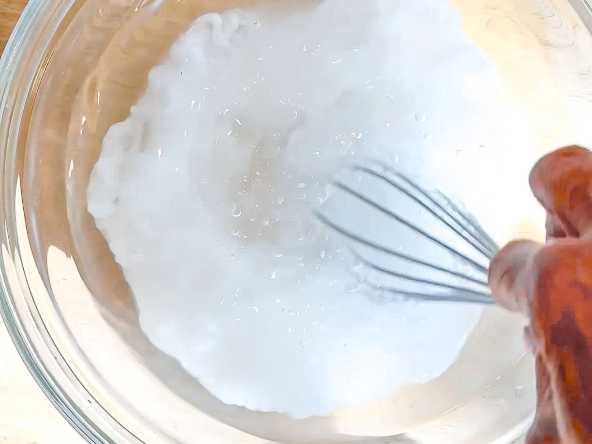 Whisking baked baking soda in cool water.