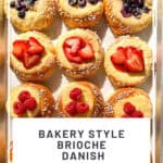 Pinterest image of berry topped brioche danishes on a parchment paper lined sheet pan.