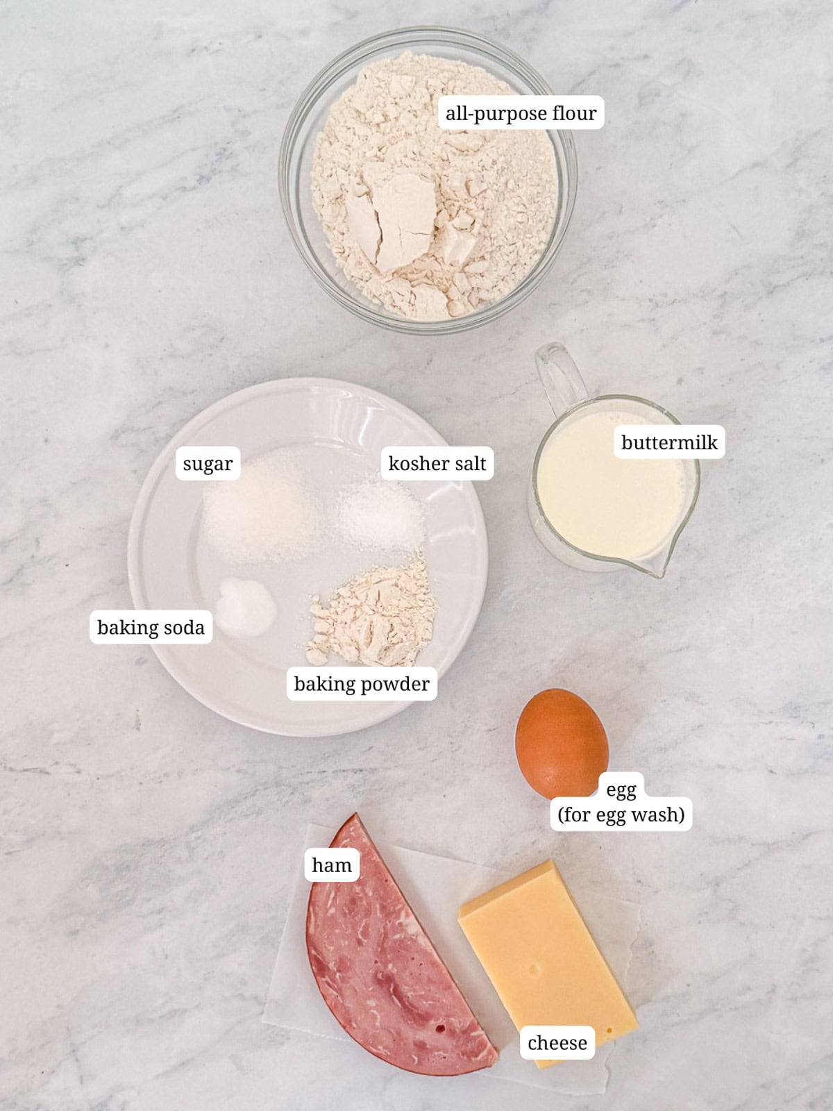 Ingredients needed to bake ham and cheese biscuits.