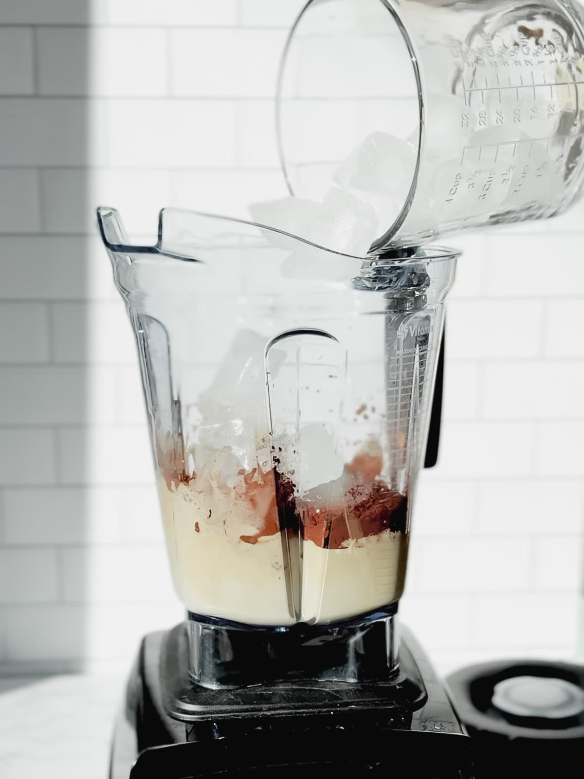 Add adding ice to a blender.
